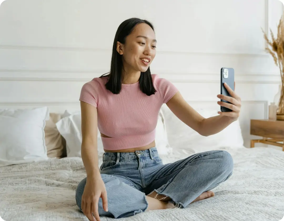 Woman taking selfie with phone